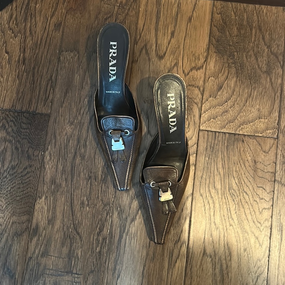 Prada mules, brown Leather upper & sole Size 35 & 1/2 Heel is 2 & 1/2 “ Good con